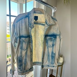 Distressed denim jacket, size medium, never worn without tags